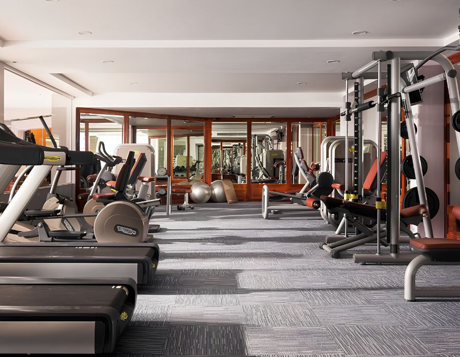 Modern fitness centre gym at J7 Hotel Siem Reap with treadmills and weight training equipment.