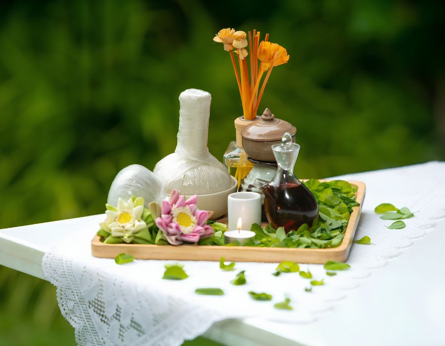Traditional herbal stamp and massage oils arrangement at Moringa Wellness Spa in J7 Hotel Siem Reap.
